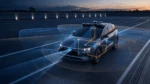 Autonomous test vehicle on a proving ground with visualized camera, radar, and lidar coverage and integrated safety paths